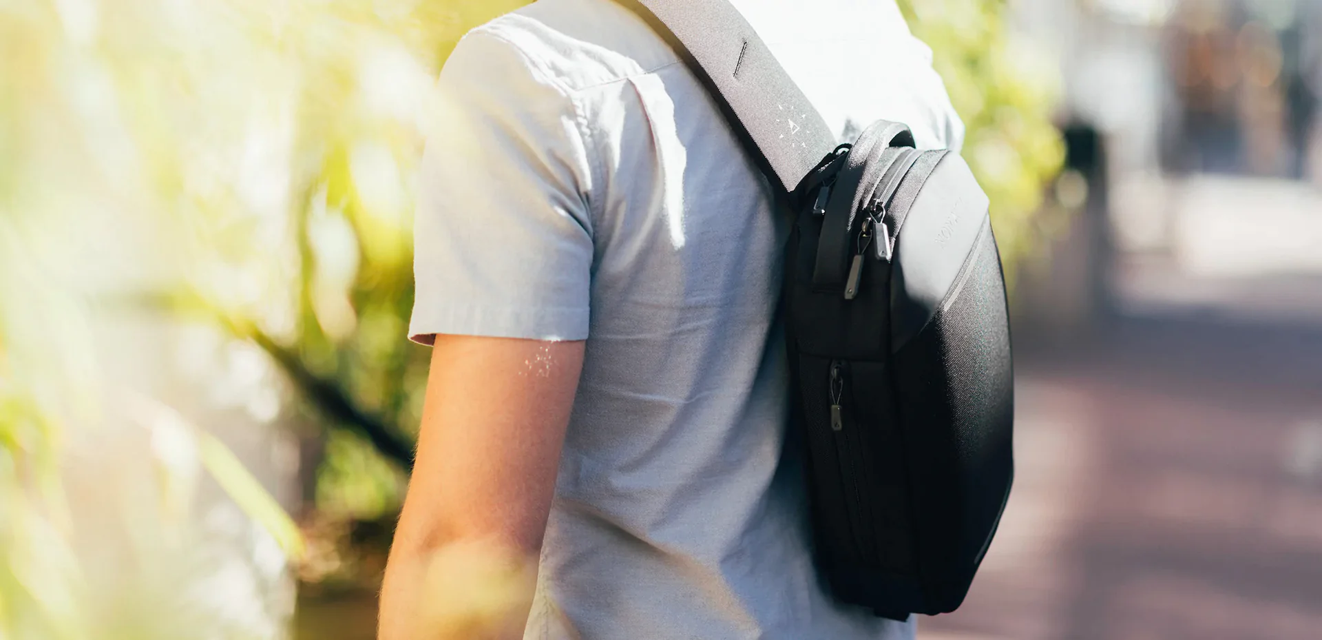 slim profile one handed carry navigator sling bag